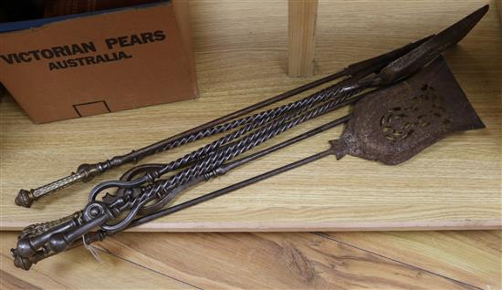 A set of three George III steel and brass fire irons and a set of three steel fire irons